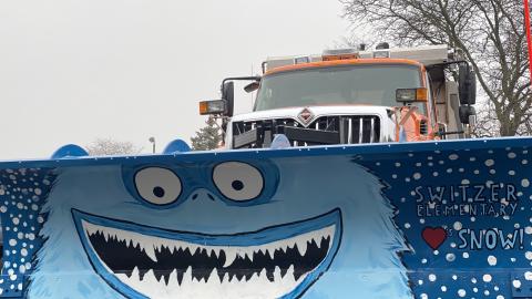 Snow plow painted with the abominable snowman by Switzer Elementary School students.