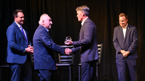 Jim Ahee accepts the Beacon of Economic Development award