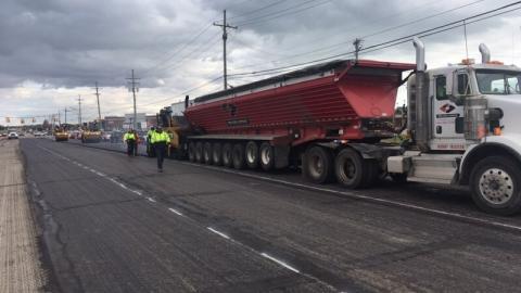 Contractor performs asphalt paving work