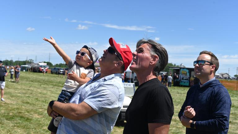Mark Hackel and Anthony Forlini looking up at the action in the sky